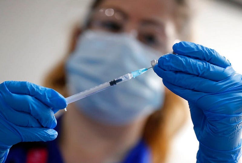 Nurse preparing a COVID-19 vaccine