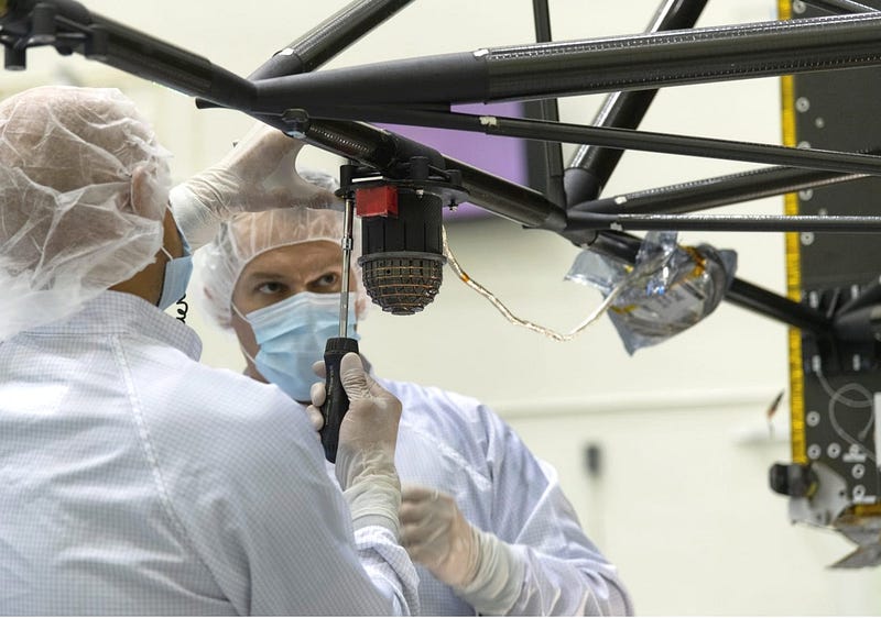 Engineers working on the Psyche spacecraft's magnetometer