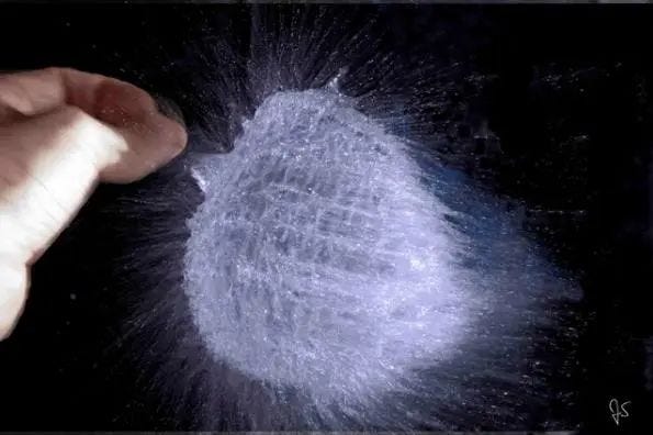 Water balloon bursting with a needle